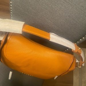 Brand New - Marc Jacobs hobo style bag. Never used. Leather. Perfect Condition!